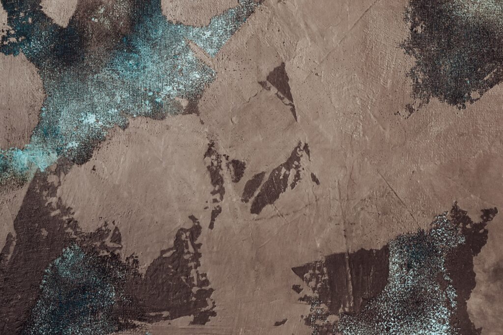 Brown decorative stucco with blue fabric mesh. Aged atmospheric texture or background